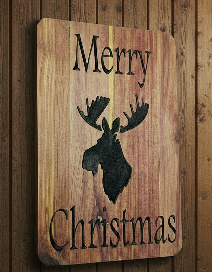 Wooden sign with a moose silhouette and 'Merry Christmas' text on a wooden background.