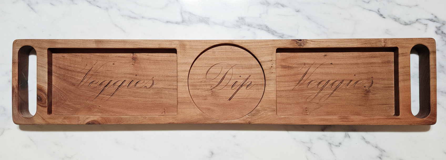 Wooden serving board with engraved text.